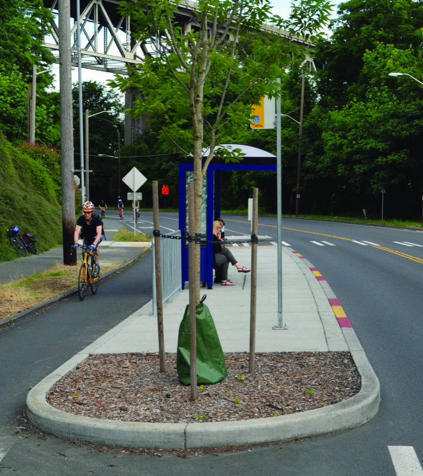 Example of an in-lane bus stop (also called a bus bulb) with protected bike lane.