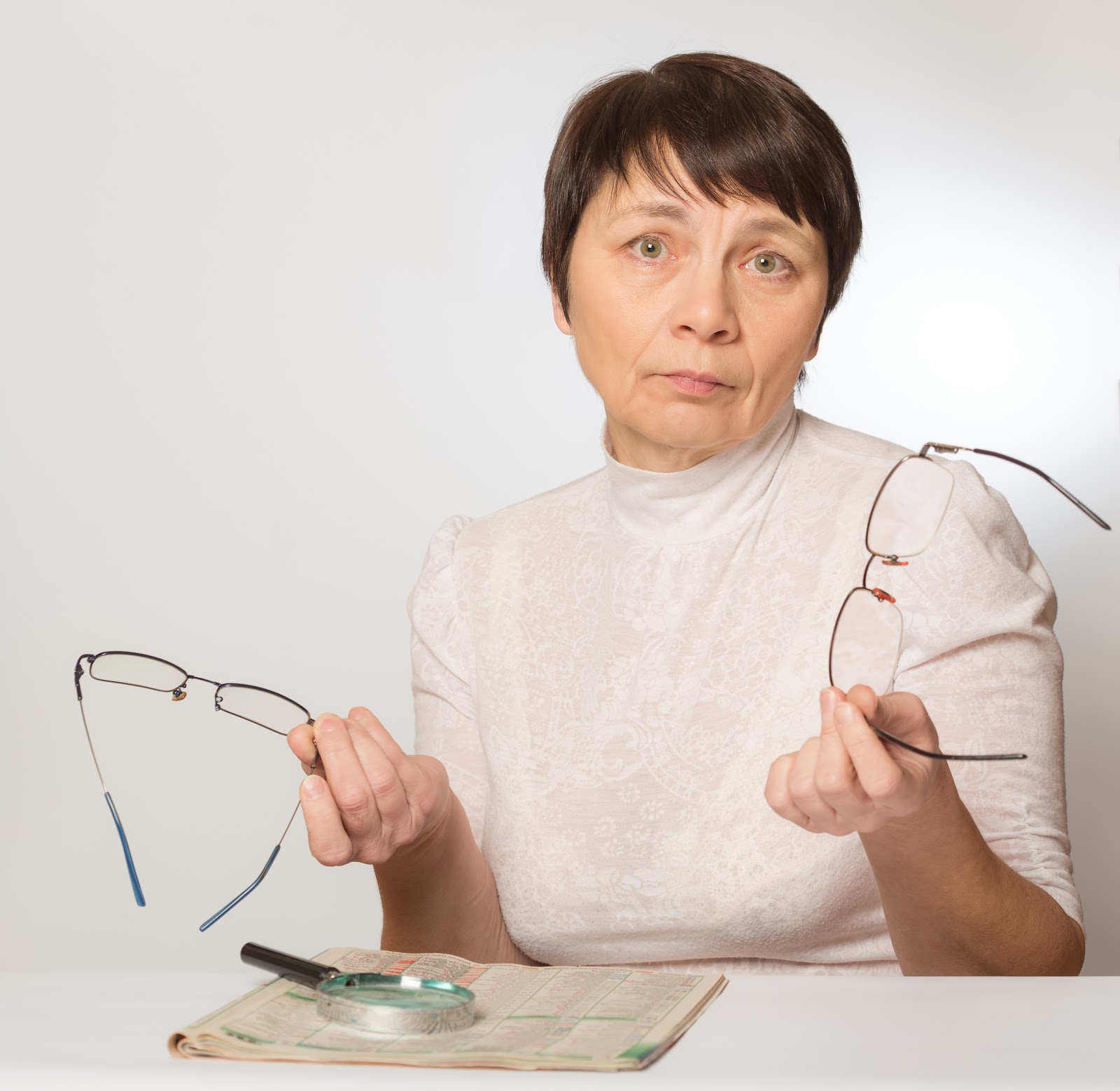 Presbyopia - woman having to switch between distance and reading glasses