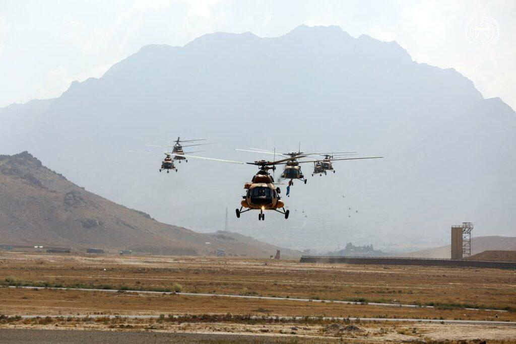 A group of helicopters flying in the air

Description automatically generated with medium confidence