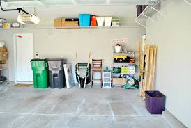 Stack items around the wall to show floor space in the garage