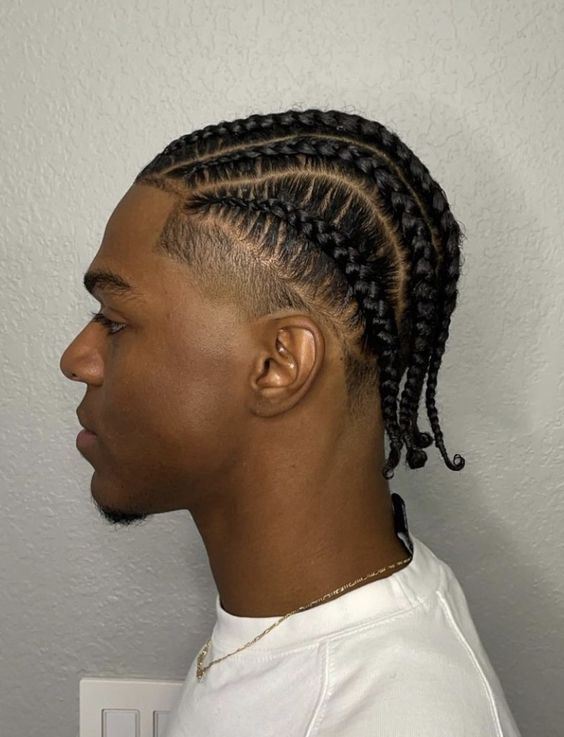 a guy wearing cornrows