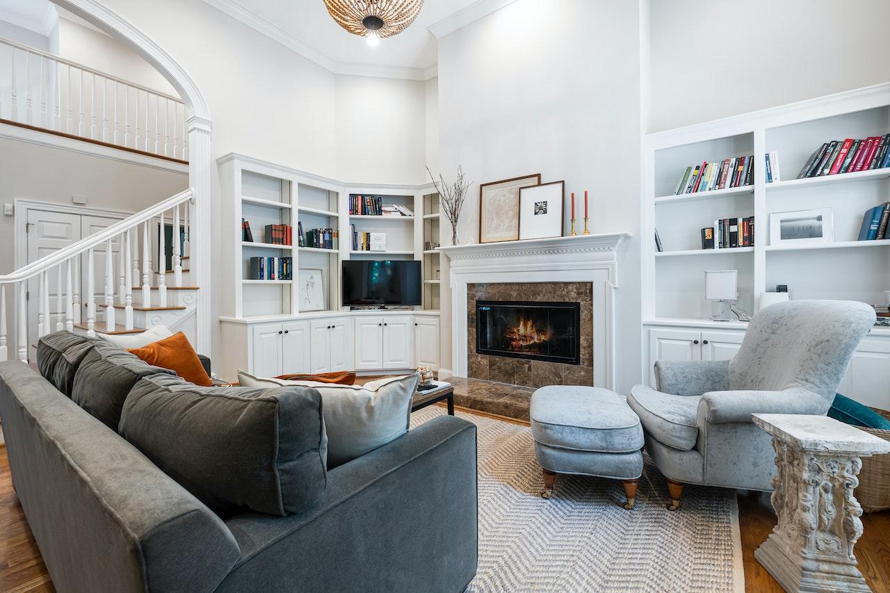 A living room with lots of storage used as one of the practical ways to utilize vertical space in your home.