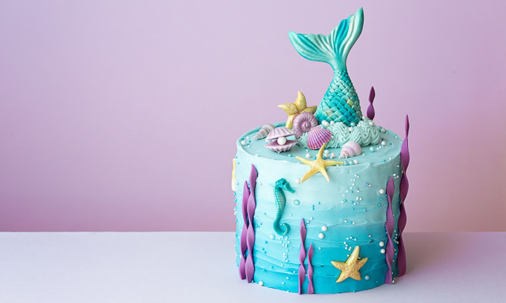 Beautiful underwater-inspired birthday cake with sophisticated toppings