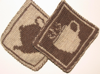 two brown knit potholders with coffee and tea colorwork designs