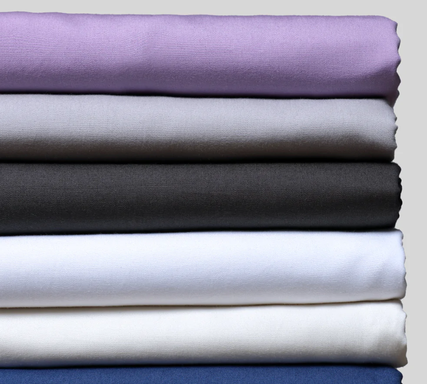 Stack of bed sheets in different colors