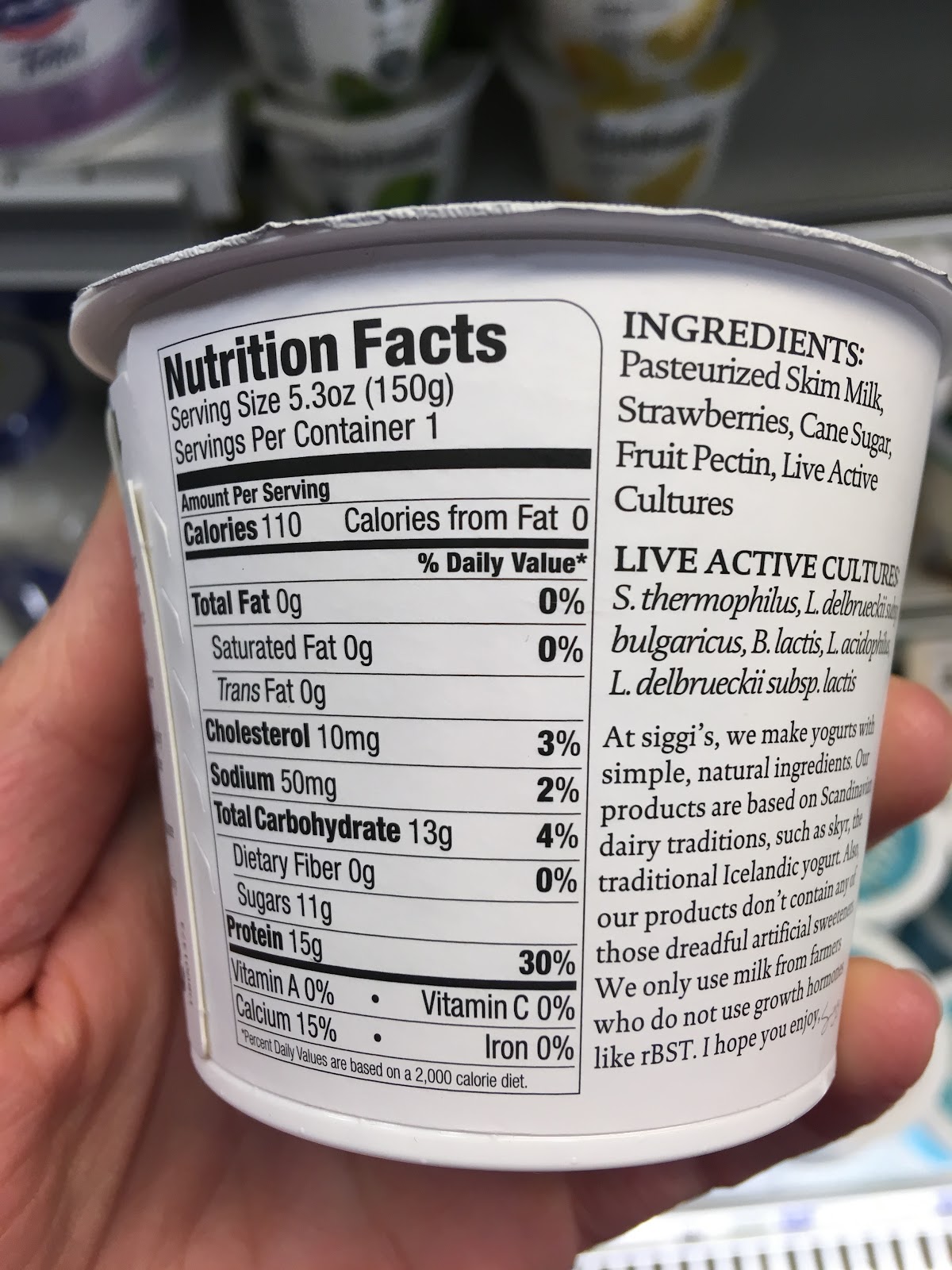 Photo of back-of-package of Siggi's strawberry yogurt. The Nutrition Facts panel reads 11g of sugar. The ingredients list reads: 