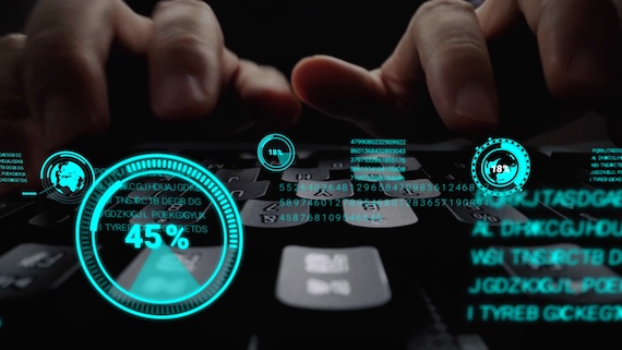 UX researcher typing with digital charts hovering above