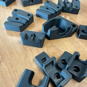 The plastic components are lighter and significantly cheaper to produce using 3D printing technology.