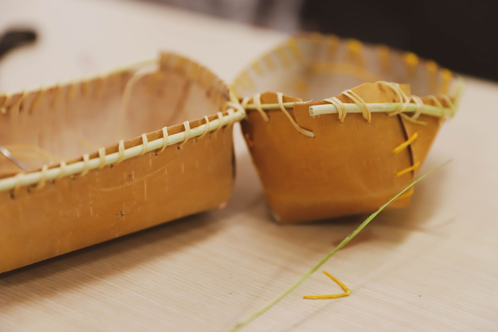 Two birch bark baskets showcasing traditional craftmanship