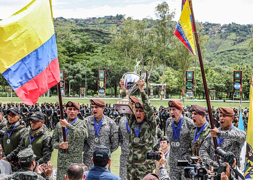 AFEAU team holds up the Fuerzas Comando 2022 trophy after winning the competition for the eleventh time.