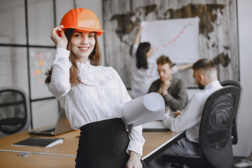 girl-signs-documents-lady-red-helmet-managerl-working-office