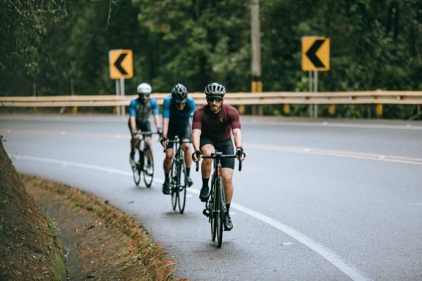 A group of people riding bikes on a road

Description automatically generated with medium confidence