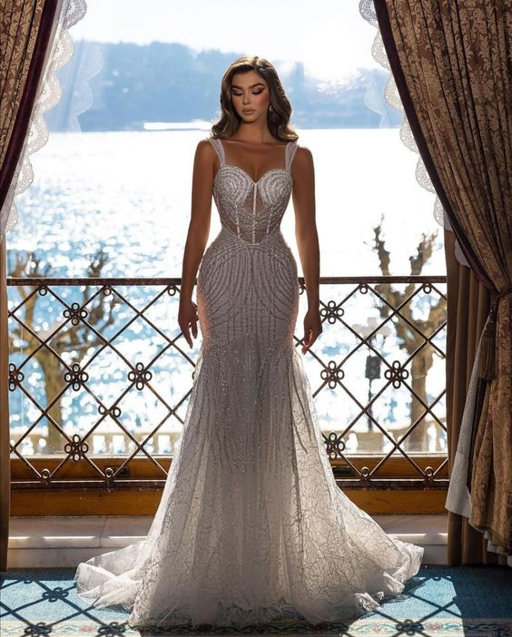 A lady wearing a corset wedding dress with glittery fabric